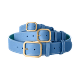 3 Laelaps Paris collars in blue with gold hardware. 