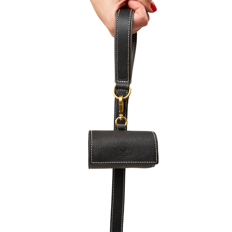 Matching black  leather  leash and waste bag holder set with gold hardware, made from embossed calf leather by Laelaps Paris 