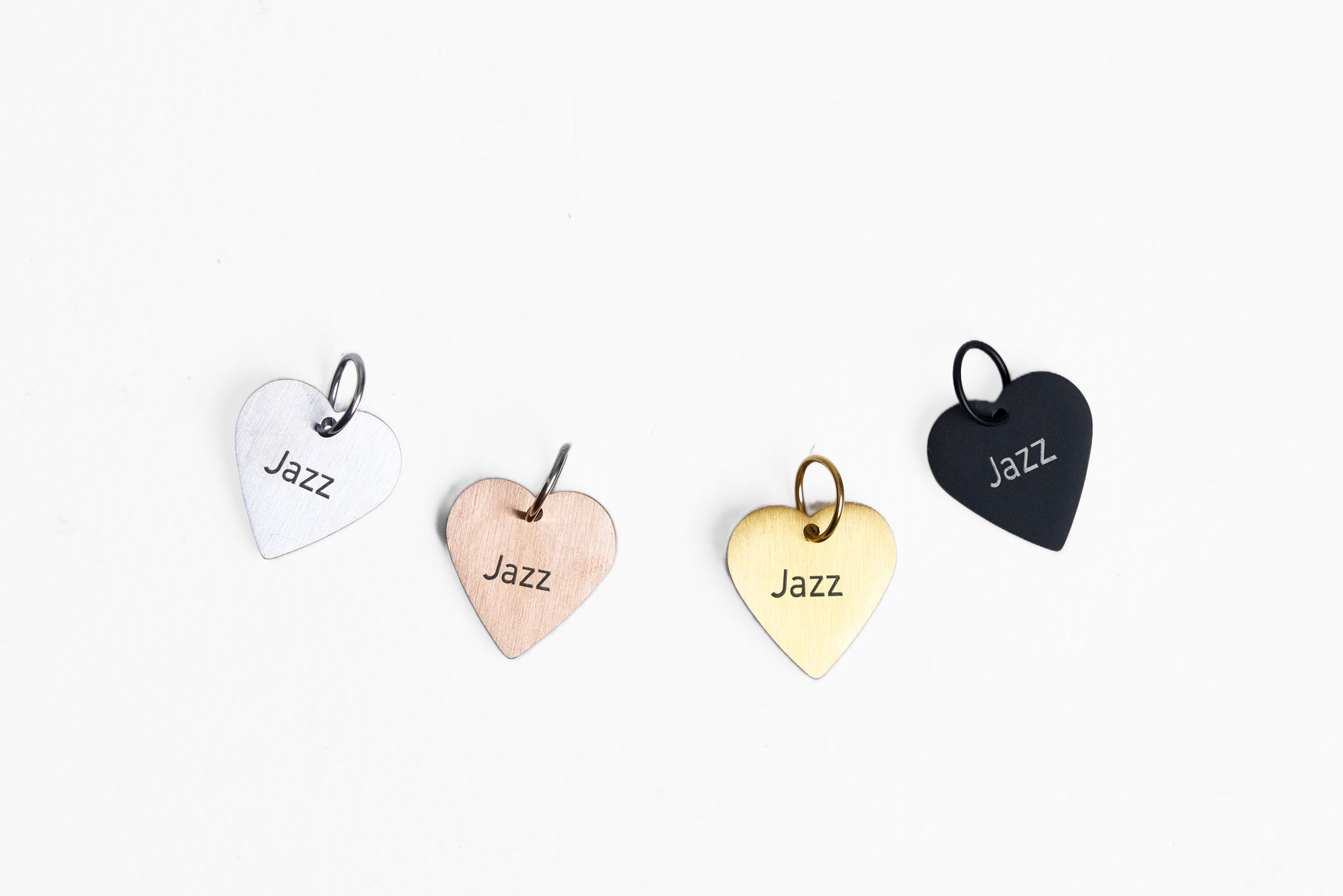 Engraved heart dog ID tags in palladium, rose gold, gold and black
