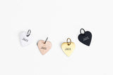 Engraved heart dog ID tags in palladium, rose gold, gold and black