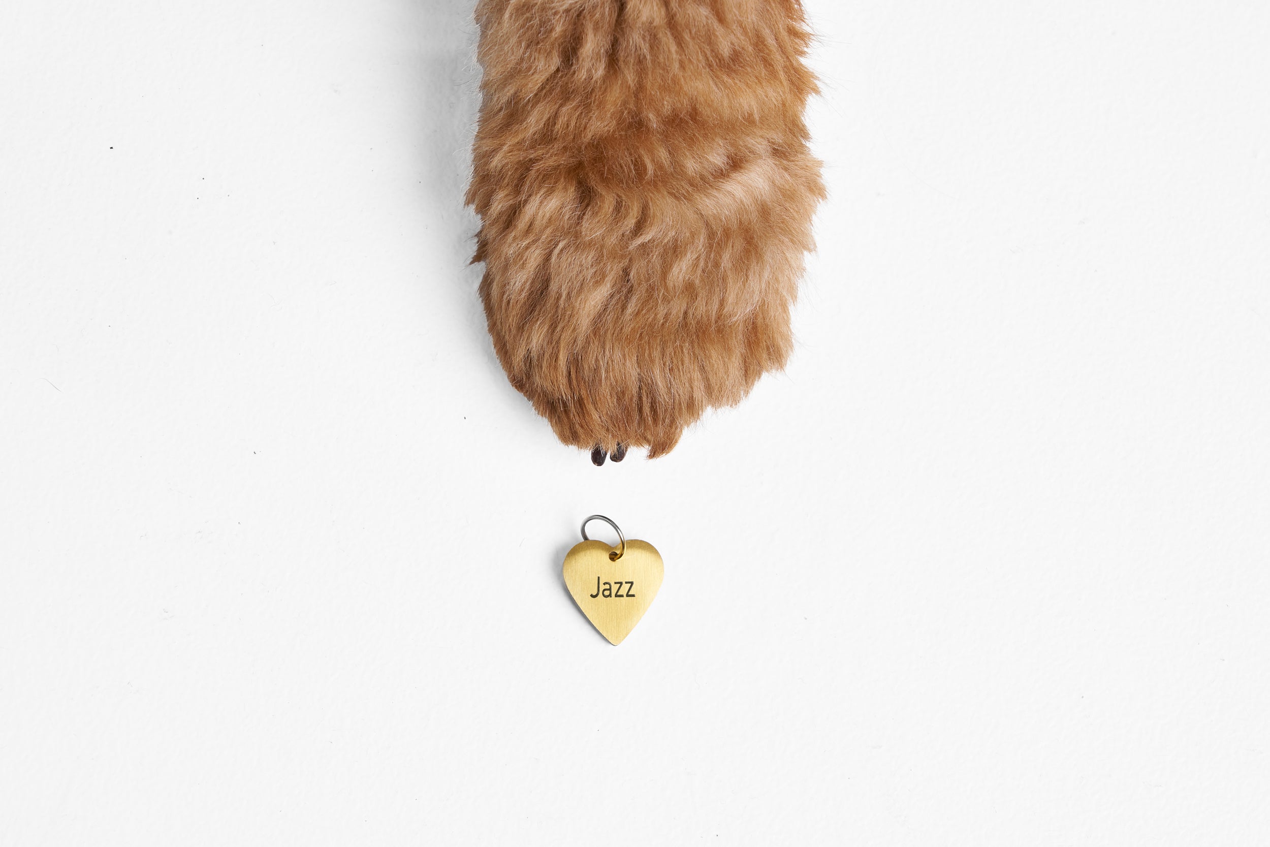 Gold heart dog ID tag engraved with the name Jazz