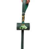 Matching green  leather  leash and waste bag holder set with gold hardware, made from embossed calf leather by Laelaps Paris 
