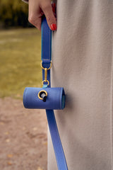 Blue leather waste bag holder with matching blue leather leash by Laelaps Paris