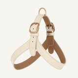 Off white leather harness with powder accents and rose mat gold hardware by Laelaps Paris. 