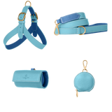 Complete light blue leather dog walking set by Laelaps Paris: harness, leash, poop bag holder and round zip treat pouch with matte gold clasp