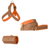 Camel leather dog harness, leash and poop bag holder set with orange lining and matte gold hardware from Laelaps Paris