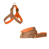 Camel embossed calf leather dog harness and matching leash with poppy orange lining, white stitching and matte gold buckles by Laelaps Paris