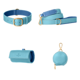Complete light blue leather dog walking set by Laelaps Paris: collar, leash, poop bag holder and round zip treat pouch with gold clasp