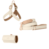 Off-white leather dog harness, leash and poop bag holder set with powder pink lining and matte rose gold hardware from Laelaps Paris