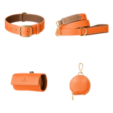Complete orange leather dog walking set by Laelaps Paris: collar, leash, poop bag holder and round zip treat pouch with gold clasp
